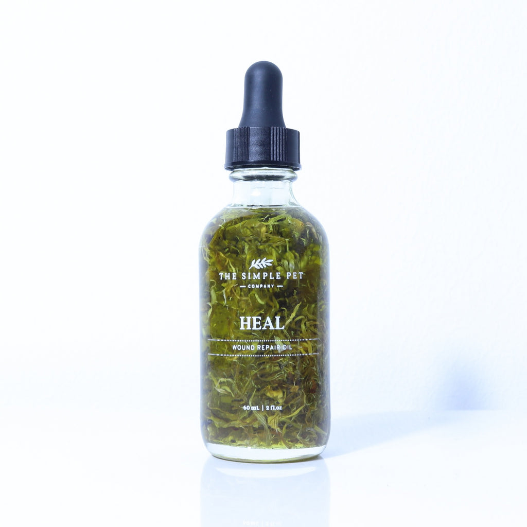 Bottle of 'HEAL' product by The Simple Pet Company with a dropper on a white background to heal dogs and cats skin